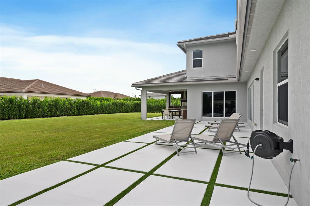 2001 Meadows Drive Davie, FL 33324 - Photo 36 of 40 a view of a house with backyard porch and garden