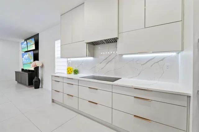 a bathroom with a sink and two mirror