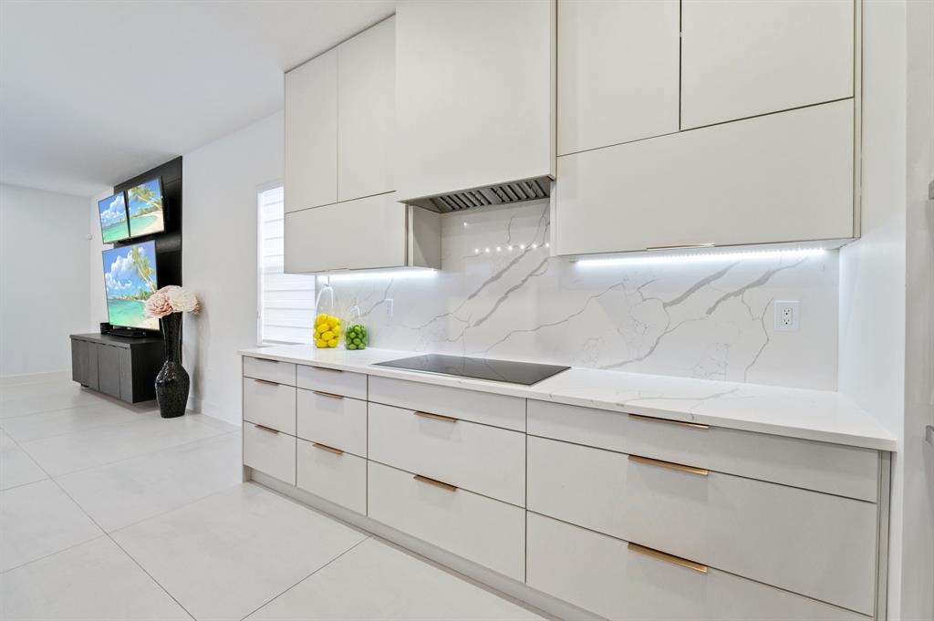 2001 Meadows Drive Davie, FL 33324 - Photo 7 of 40 a bathroom with a sink and two mirror
