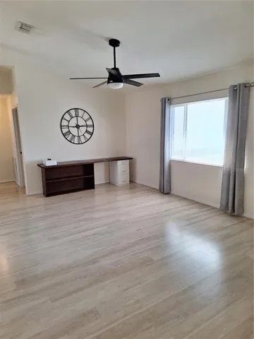 a view of room with window and hardwood floor
