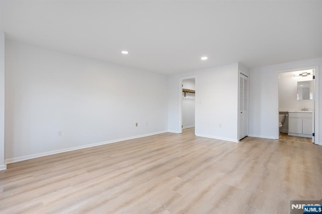 105 Nelson Court Edgewater, NJ 07020 - Photo 13 of 18 a view of empty room with wooden floor