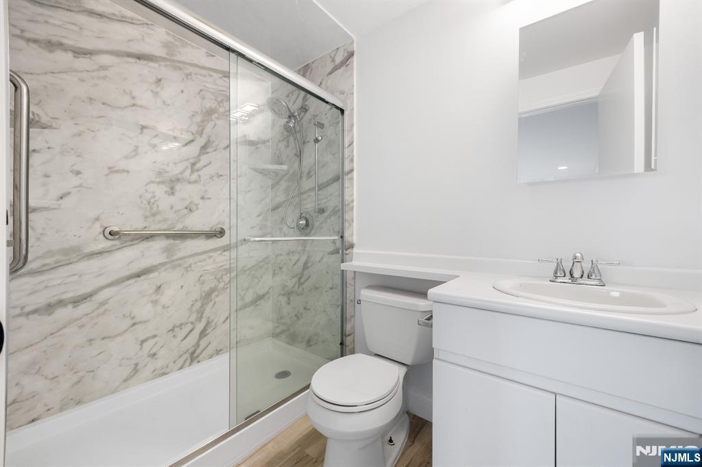 105 Nelson Court Edgewater, NJ 07020 - Photo 15 of 18 a bathroom with a sink toilet and shower