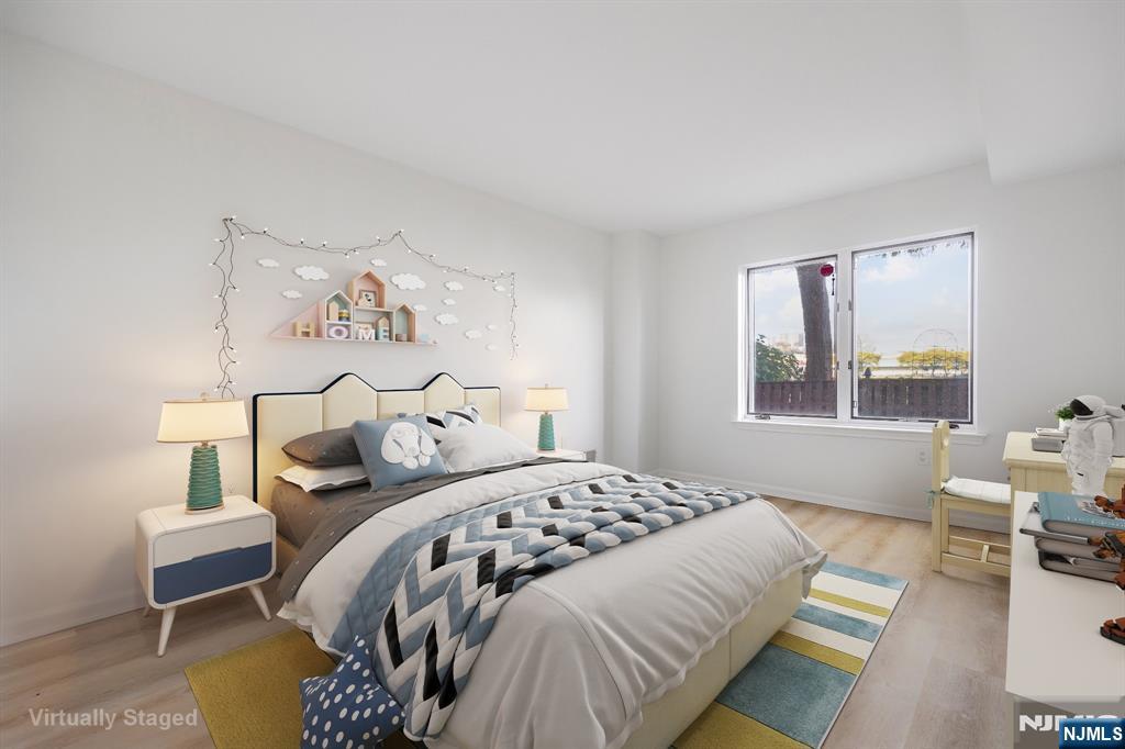 105 Nelson Court Edgewater, NJ 07020 - Photo 3 of 18 a bedroom with a bed and a window
