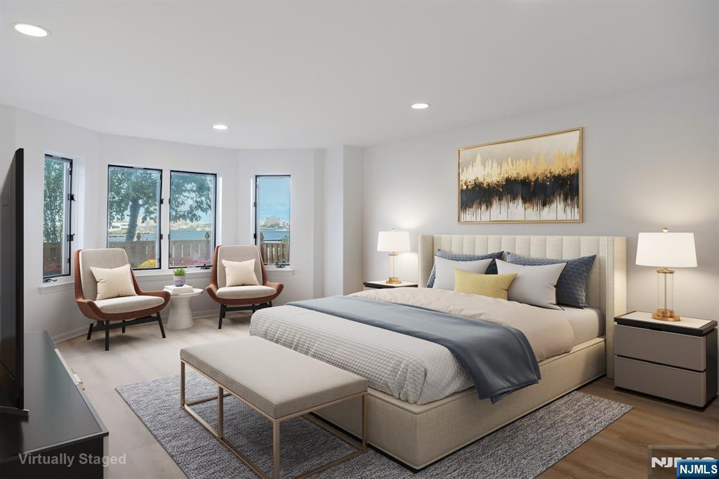 105 Nelson Court Edgewater, NJ 07020 - Photo 4 of 18 a bedroom with furniture and a large window