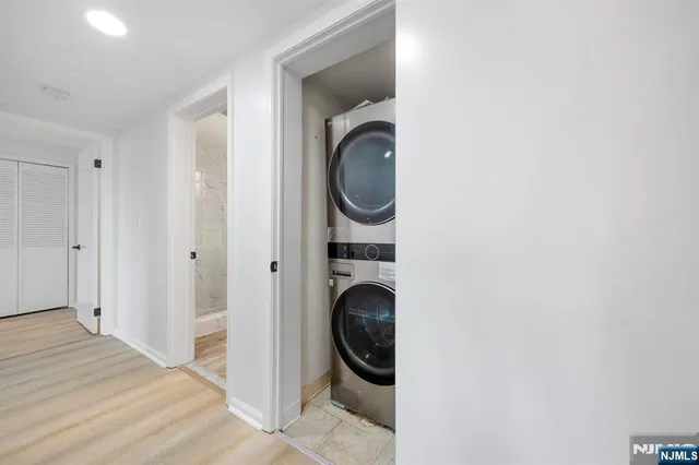 a view of a hallway with washer and dryer
