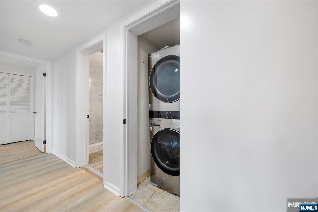 105 Nelson Court Edgewater, NJ 07020 - Photo 9 of 18 a view of a hallway with washer and dryer
