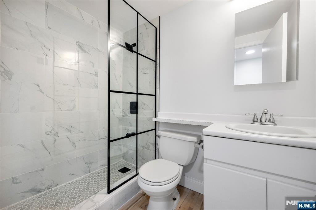 105 Nelson Court Edgewater, NJ 07020 - Photo 10 of 18 a bathroom with a sink toilet and shower