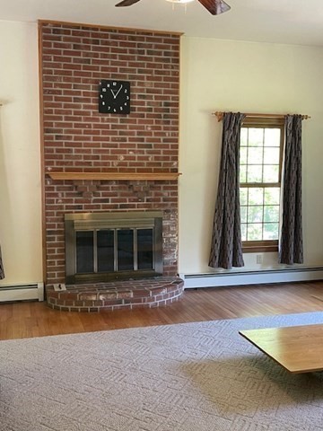 140 South Shaker Road Harvard, MA 01451 - Photo 13 of 38 a view of an empty room with a fireplace and a window