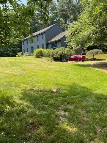 140 South Shaker Road Harvard, MA 01451 - Photo 2 of 38 a front view of house with yard and trees