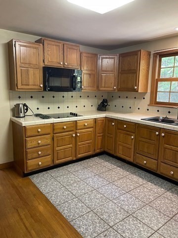 140 South Shaker Road Harvard, MA 01451 - Photo 3 of 38 a kitchen with stainless steel appliances a sink dishwasher stove top oven and wooden cabinets