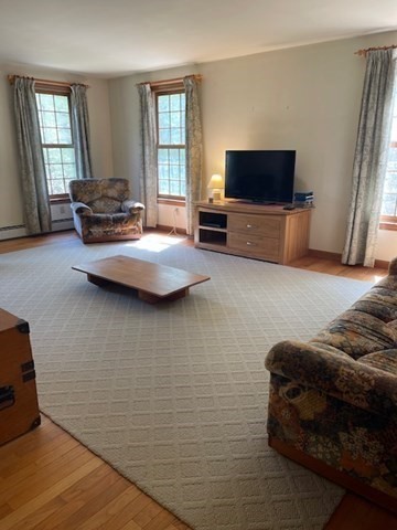 140 South Shaker Road Harvard, MA 01451 - Photo 8 of 38 a living room with furniture and a flat screen tv
