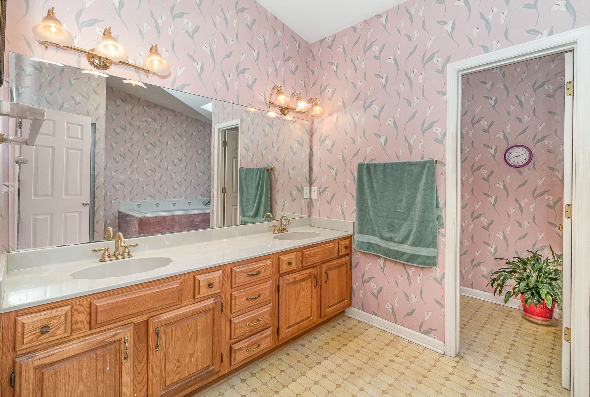 2437 Ravine Drive Nashville, TN 37217 - Photo 16 of 33 a bathroom with a double vanity sink mirror and shower