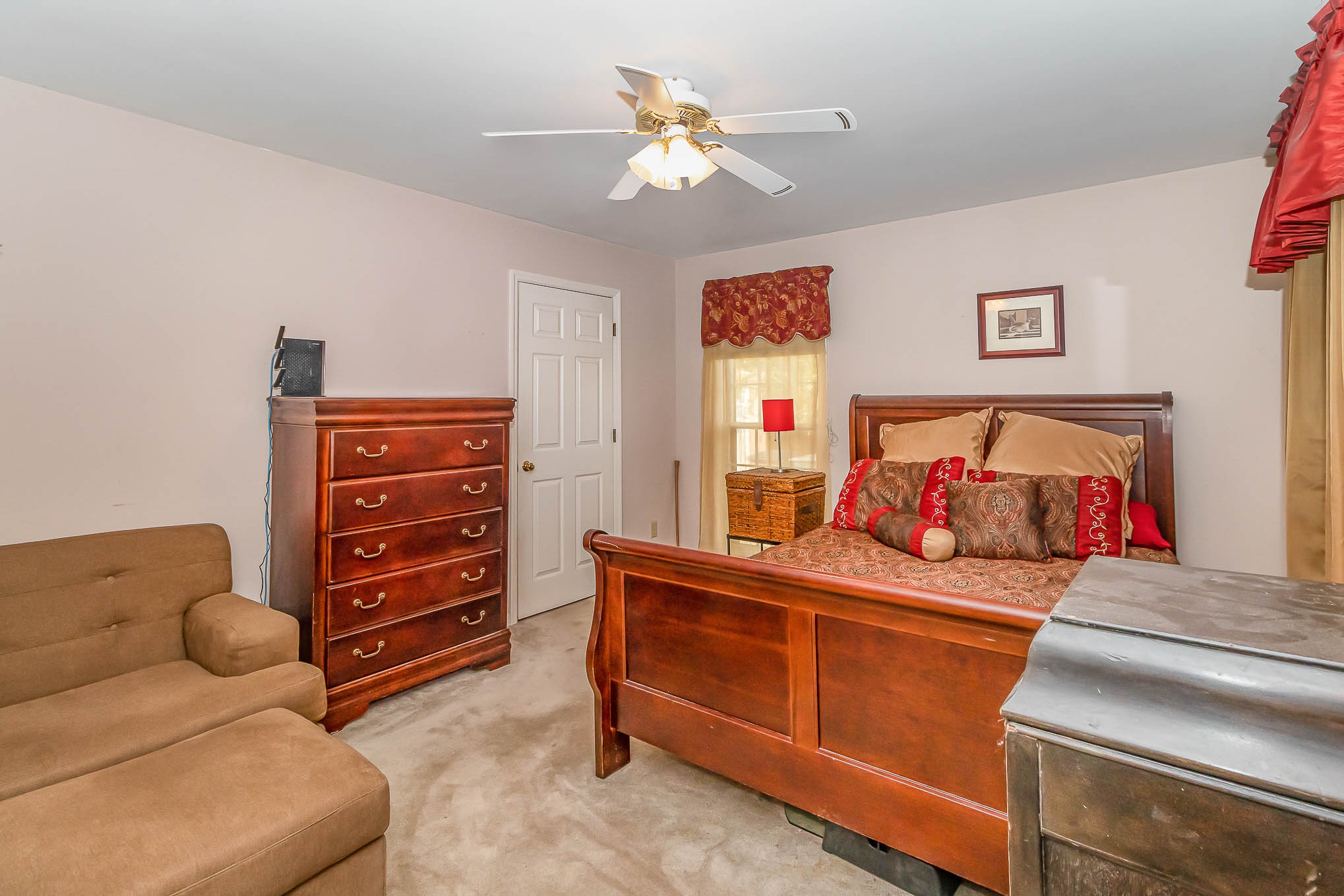 2437 Ravine Drive Nashville, TN 37217 - Photo 19 of 33 a bedroom with furniture and a chandelier