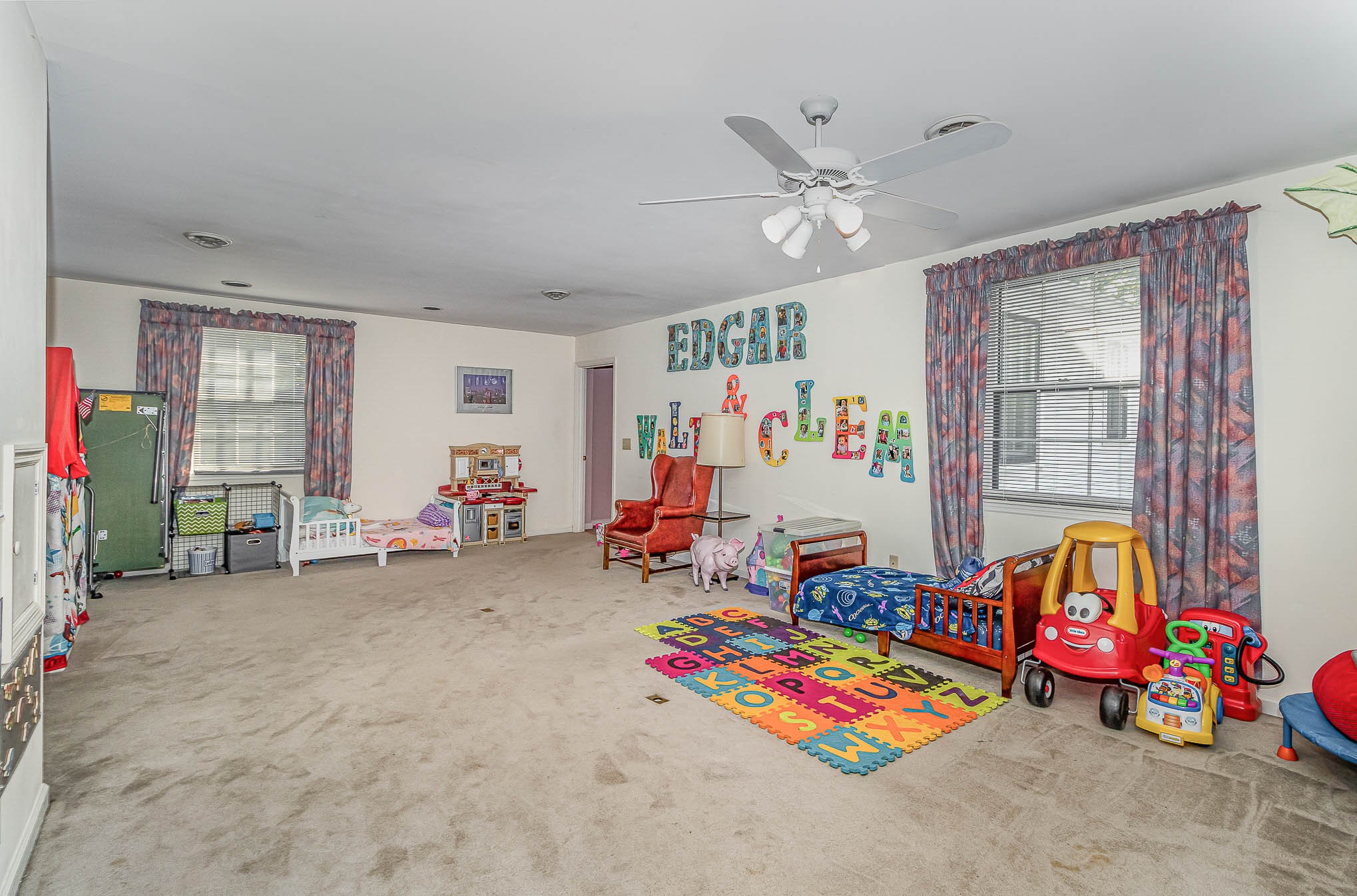 2437 Ravine Drive Nashville, TN 37217 - Photo 21 of 33 a living room with lots of furniture and a chandelier