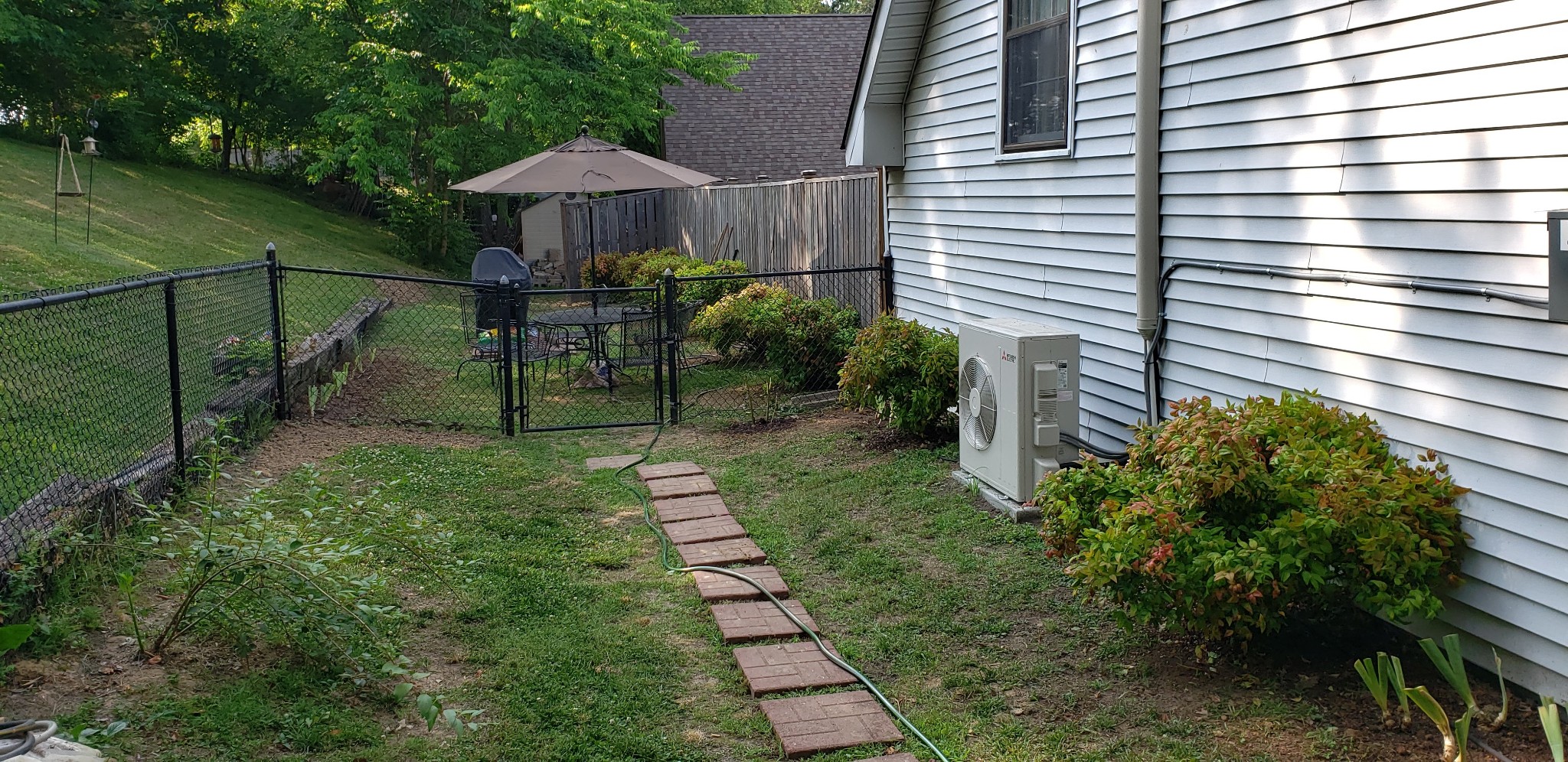 2437 Ravine Drive Nashville, TN 37217 - Photo 29 of 33 a view of a patio with chair and tables under an umbrella