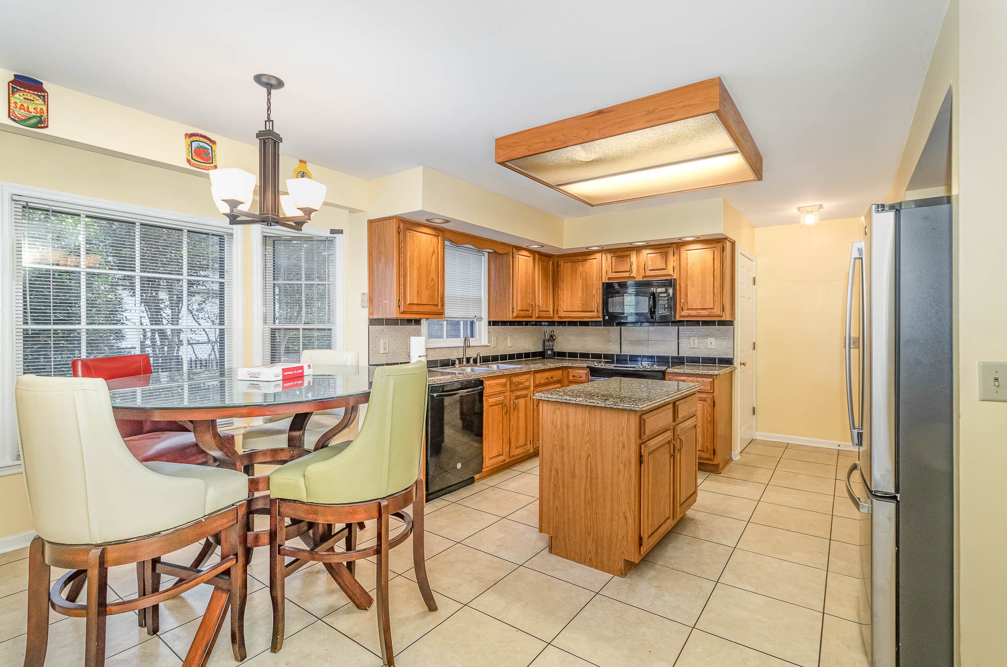 2437 Ravine Drive Nashville, TN 37217 - Photo 4 of 33 a kitchen with a stove a sink and a refrigerator