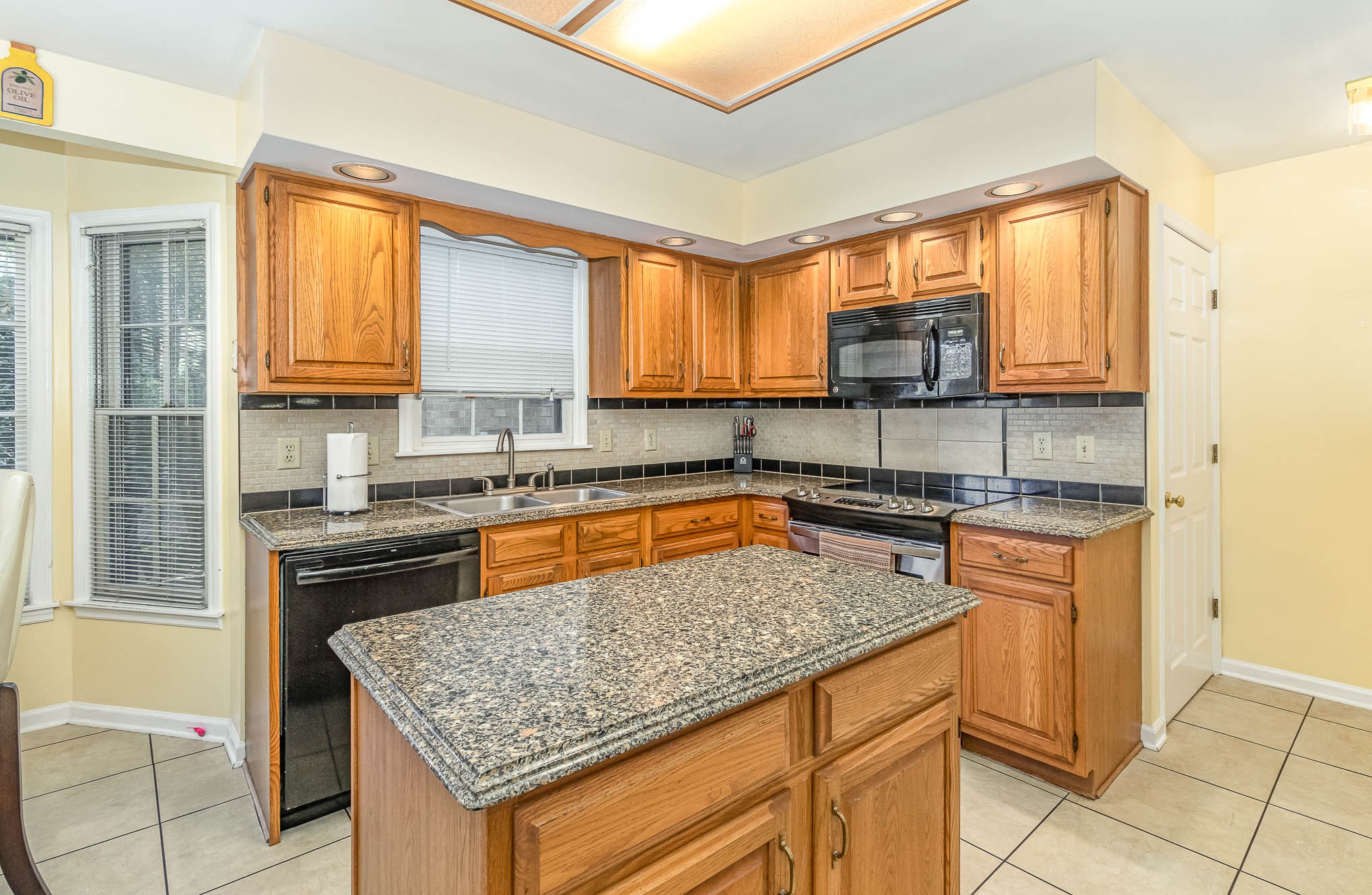 2437 Ravine Drive Nashville, TN 37217 - Photo 5 of 33 a kitchen with stainless steel appliances granite countertop a stove sink and cabinets