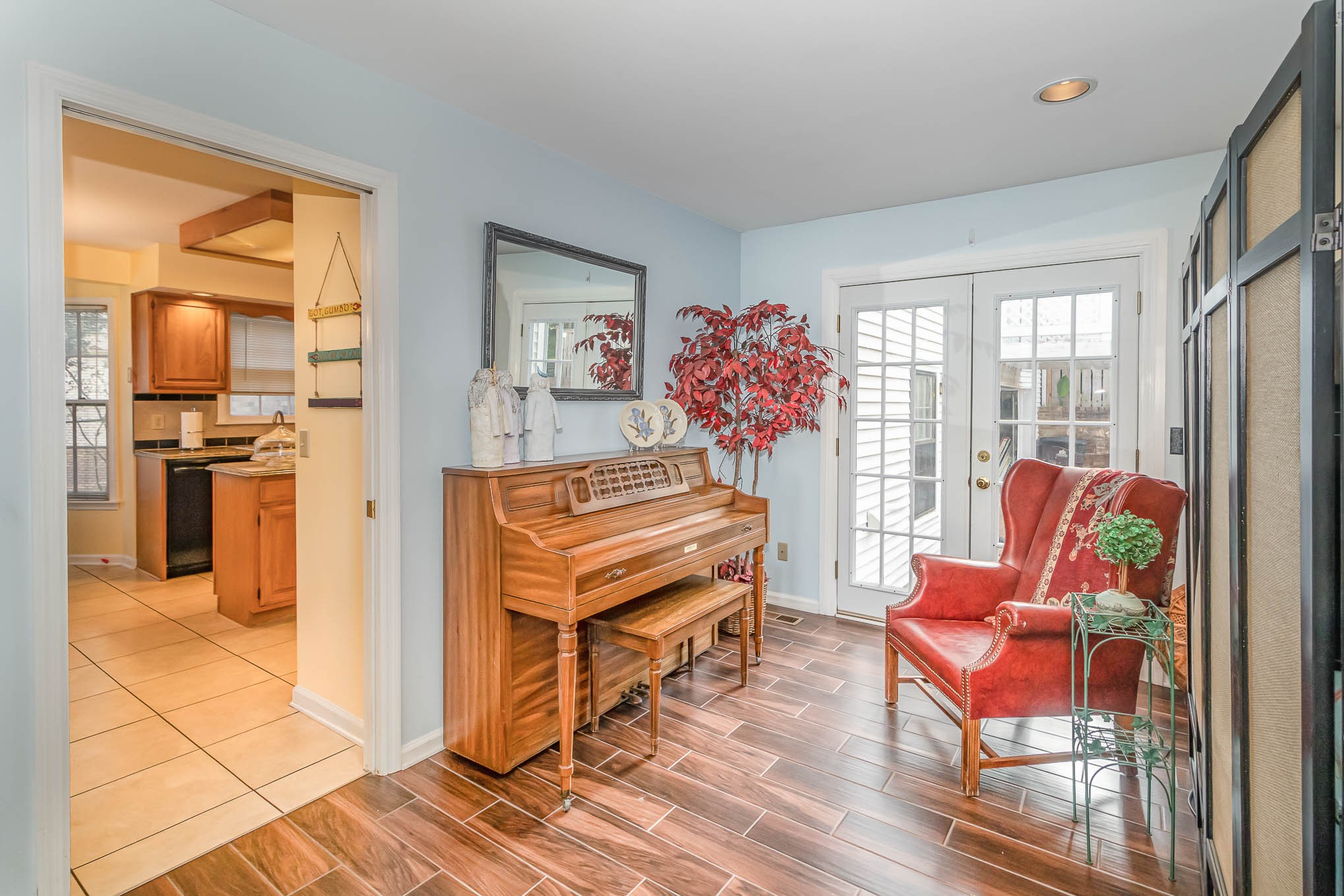2437 Ravine Drive Nashville, TN 37217 - Photo 10 of 33 a living room with furniture a fireplace and a kitchen view