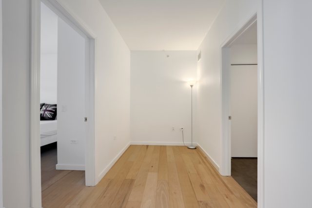 100 East 14th Street, Unit 708 Chicago, IL 60605 - Photo 11 of 25 a view of a hallway with wooden floor