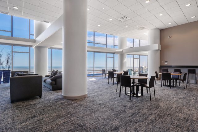 100 East 14th Street, Unit 708 Chicago, IL 60605 - Photo 20 of 25 a view of a dining room with furniture window and outside view