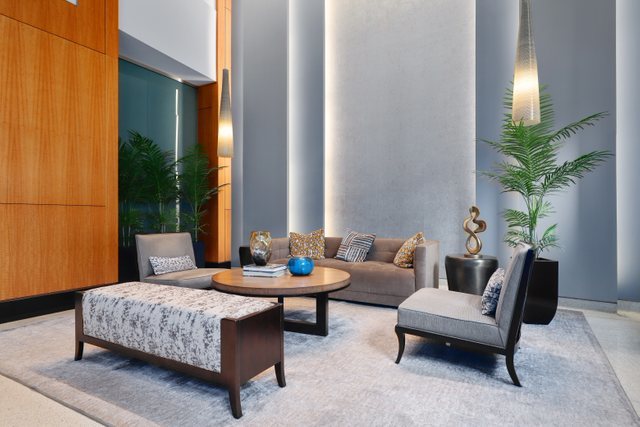 100 East 14th Street, Unit 708 Chicago, IL 60605 - Photo 24 of 25 a living room with furniture and a potted plant