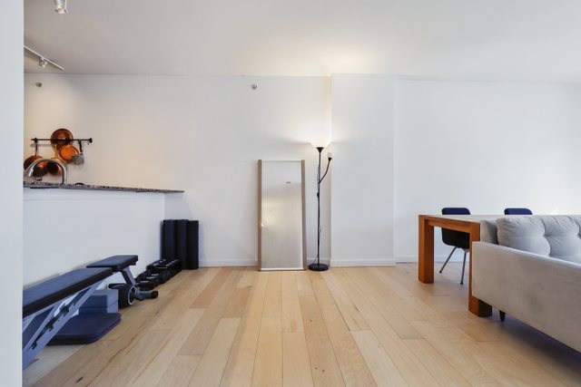 100 East 14th Street, Unit 708 Chicago, IL 60605 - Photo 6 of 25 a livingroom with window and couch