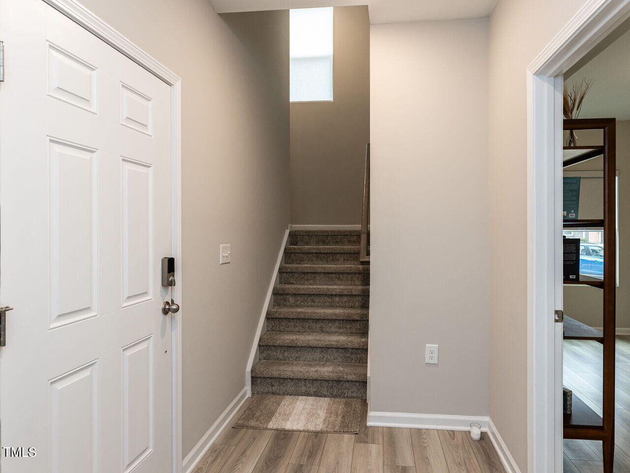 730 Firebrick Drive Cary, NC 27519 - Photo 6 of 38 a view of a hallway with wooden floor and entryway