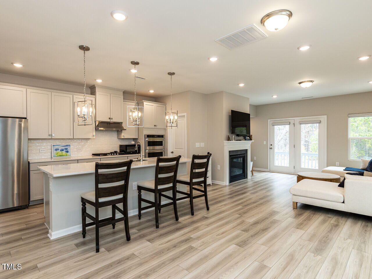 730 Firebrick Drive Cary, NC 27519 - Photo 10 of 38 a open kitchen with white cabinets and stainless steel appliances