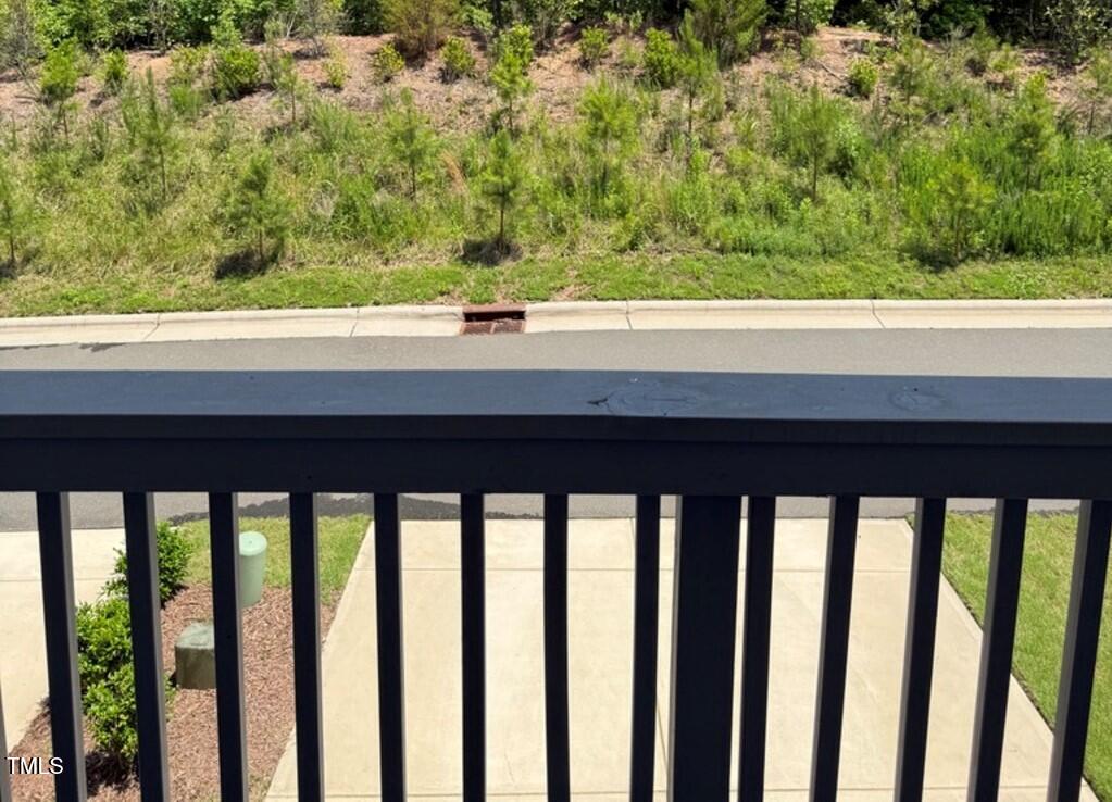 730 Firebrick Drive Cary, NC 27519 - Photo 16 of 38 a view of a balcony with wooden floor and fence