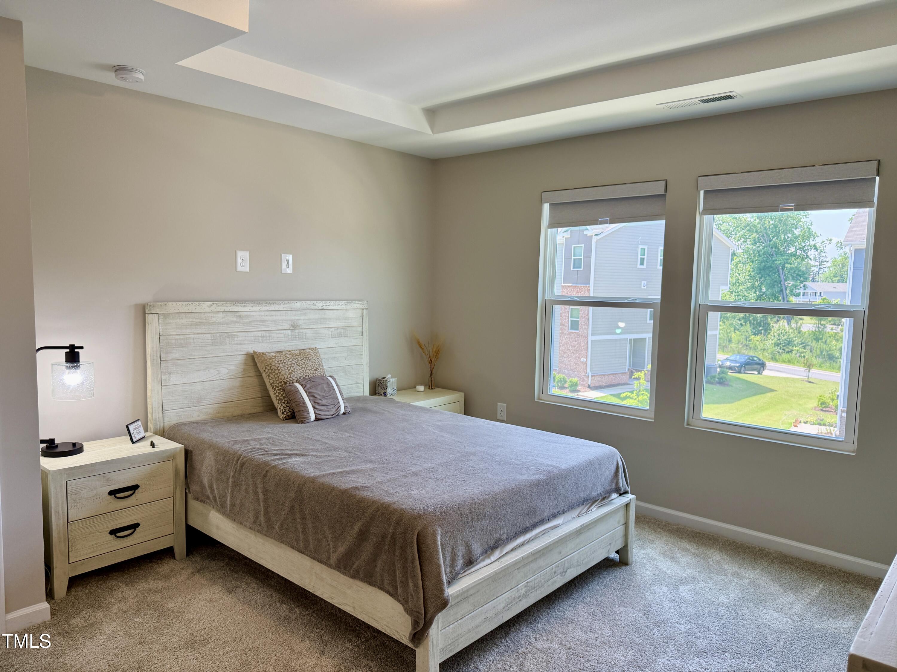 730 Firebrick Drive Cary, NC 27519 - Photo 21 of 38 a bedroom with a bed and a window