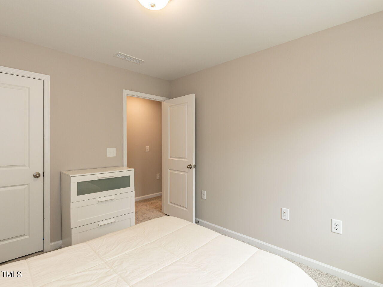 730 Firebrick Drive Cary, NC 27519 - Photo 27 of 38 a bedroom with a bed and a dresser
