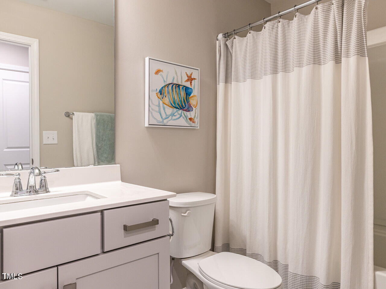 730 Firebrick Drive Cary, NC 27519 - Photo 28 of 38 a bathroom with a sink a toilet and a mirror