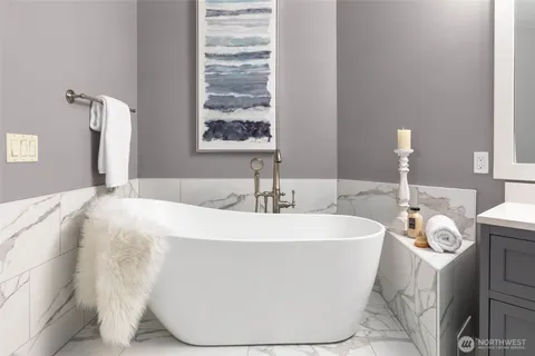 a white bath tub sitting in a bathroom