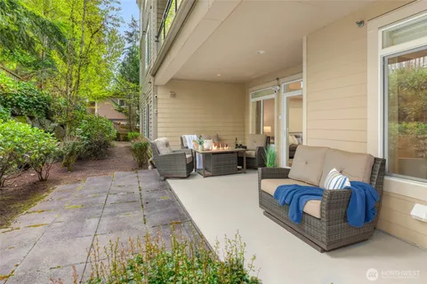 a view of a patio with couches and potted plants
