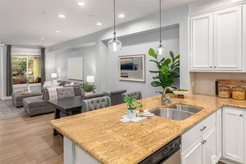 a kitchen with center island table and chairs