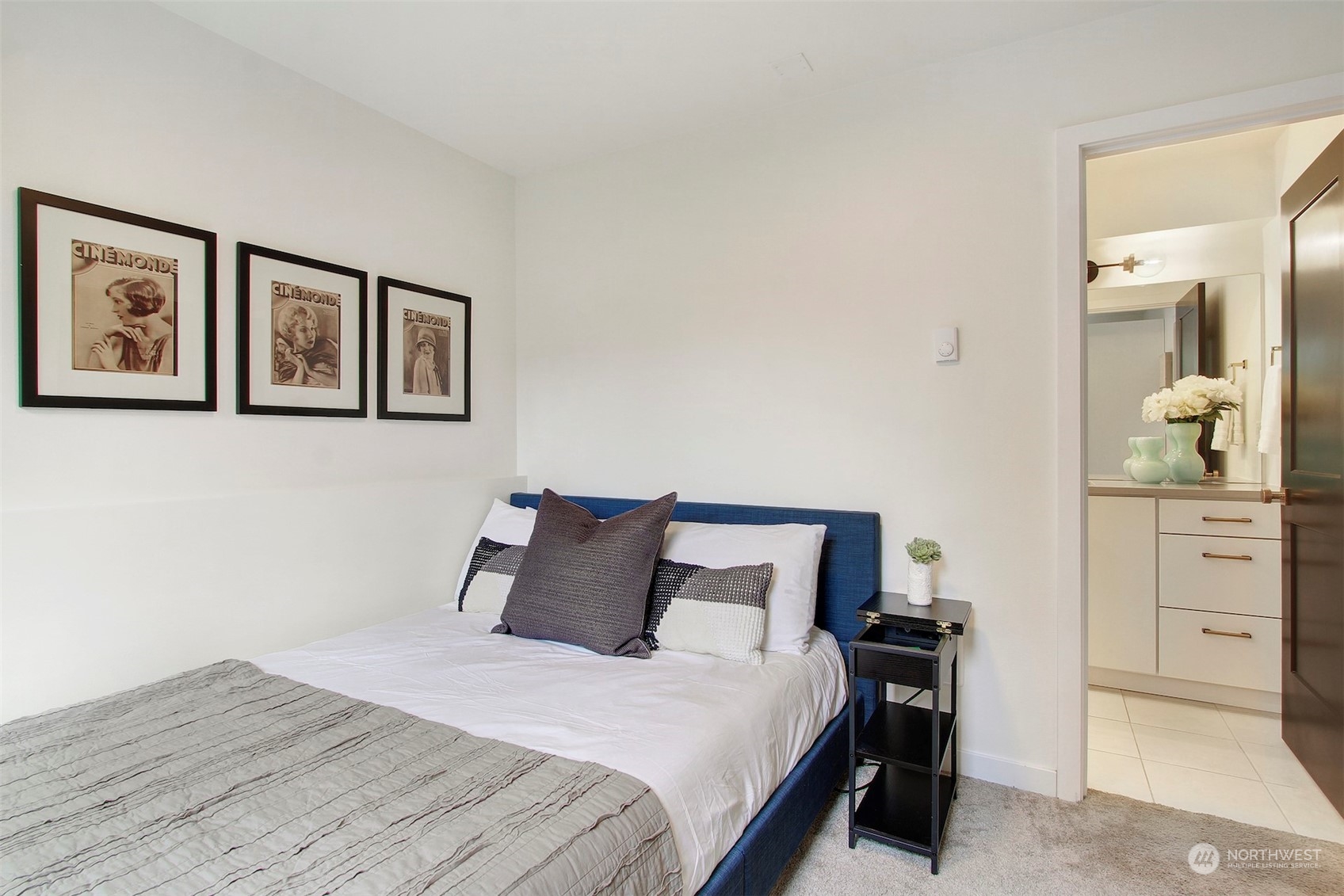 1213 East Mercer Street Seattle, WA 98102 - Photo 2 of 29 a bedroom with a bed and cabinet
