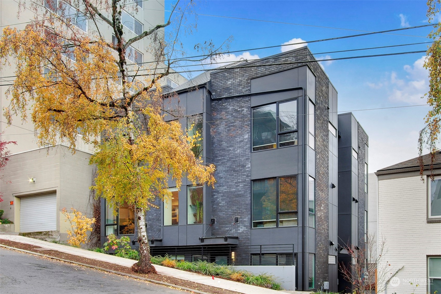 1213 East Mercer Street Seattle, WA 98102 - Photo 24 of 29 a view of a brick house with a large windows
