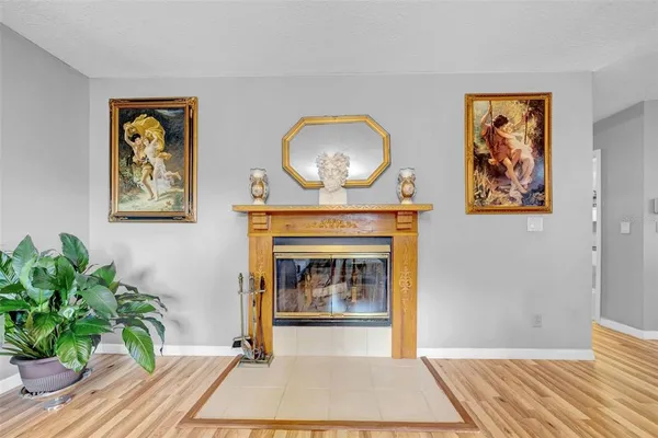a living room with lots of furniture and a book shelf