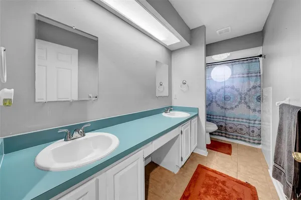 a view of kitchen with stainless steel appliances granite countertop a refrigerator and a stove top oven