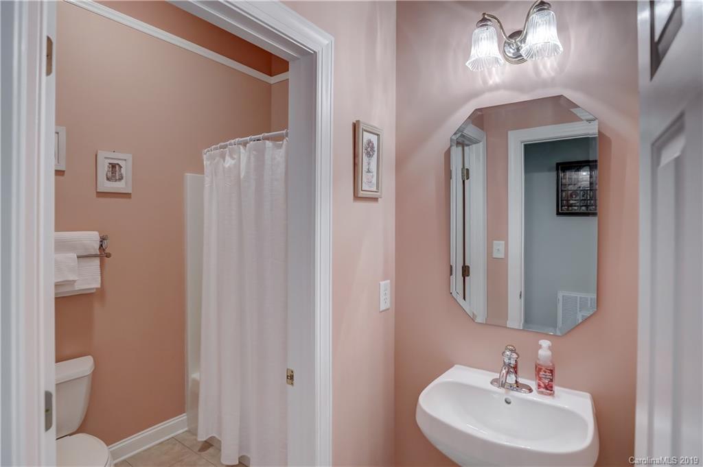 779 Julia Street Fort Mill, SC 29708 - Photo 11 of 48 a bathroom with a sink and a mirror