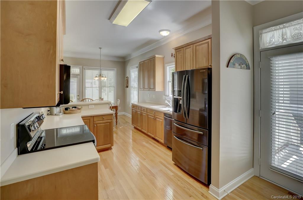 779 Julia Street Fort Mill, SC 29708 - Photo 16 of 48 a kitchen with stainless steel appliances granite countertop a refrigerator stove and sink