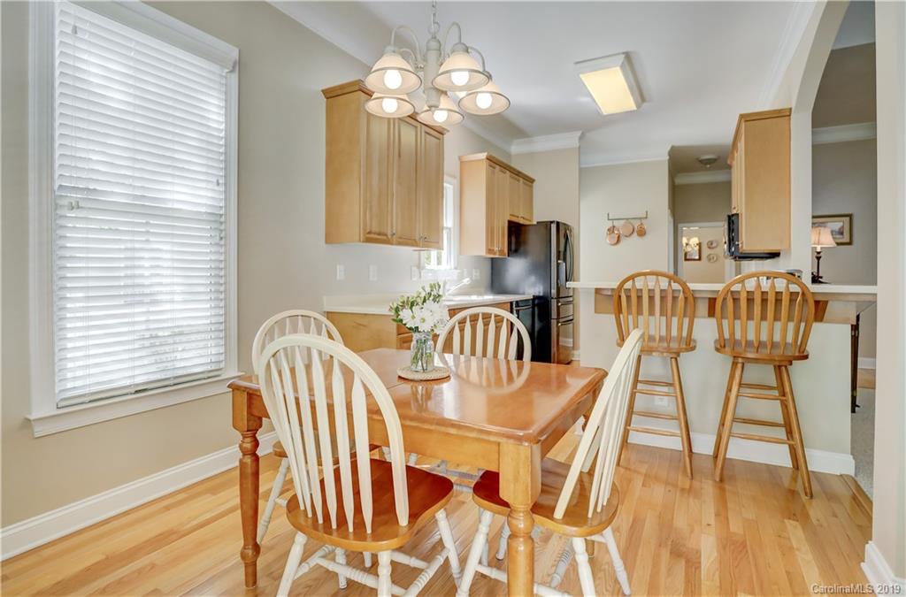 779 Julia Street Fort Mill, SC 29708 - Photo 20 of 48 a view of a dining room with furniture and wooden floor