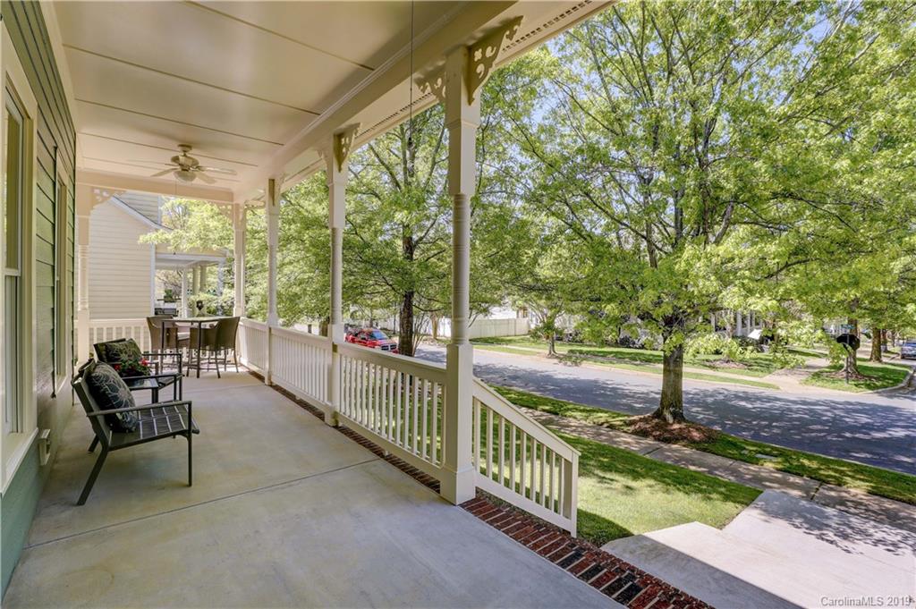 779 Julia Street Fort Mill, SC 29708 - Photo 3 of 48 a view of a porch with chairs and wooden fence