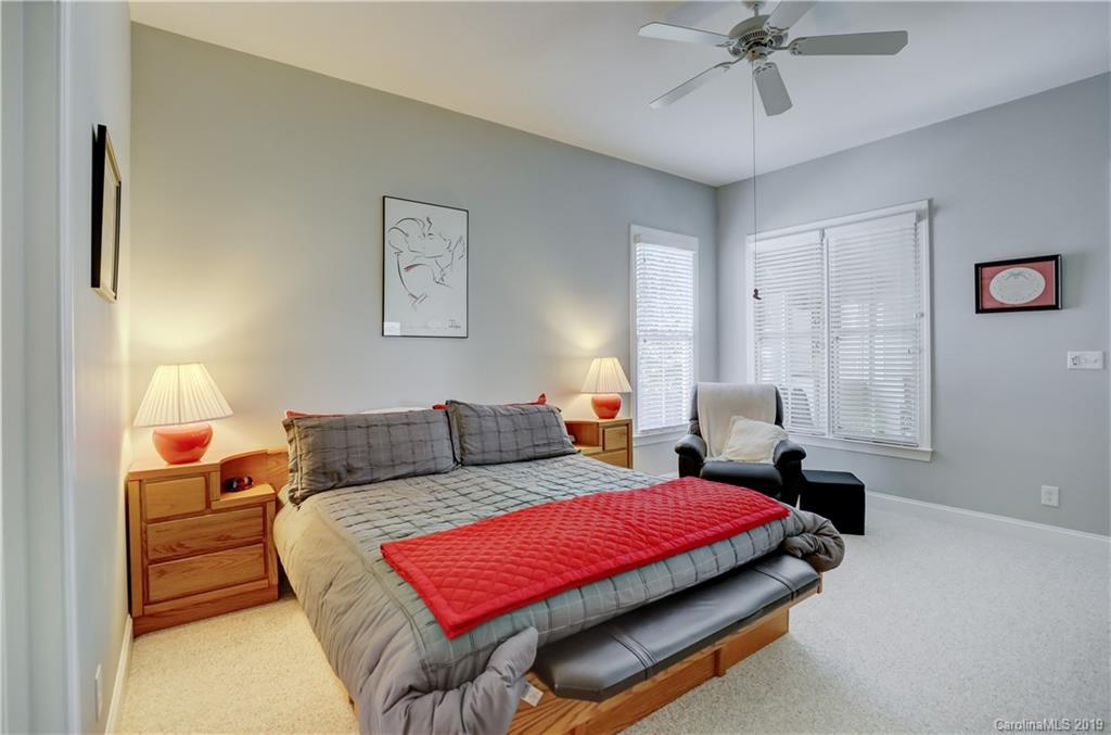 779 Julia Street Fort Mill, SC 29708 - Photo 21 of 48 a bedroom with a bed and wooden floor