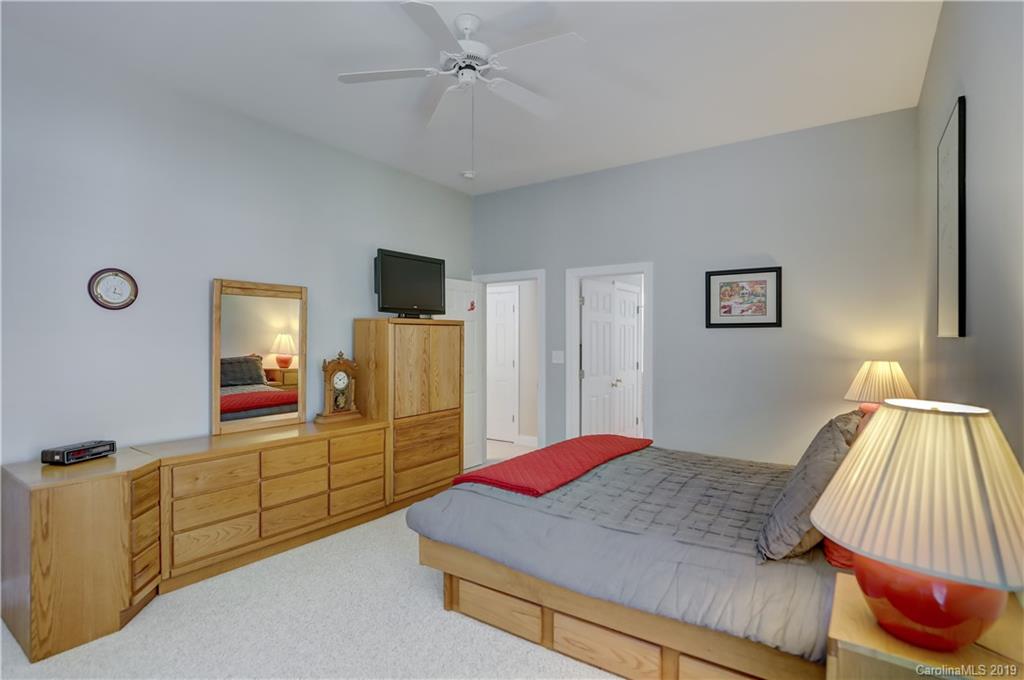 779 Julia Street Fort Mill, SC 29708 - Photo 23 of 48 a bedroom with a bed and a view of bathroom