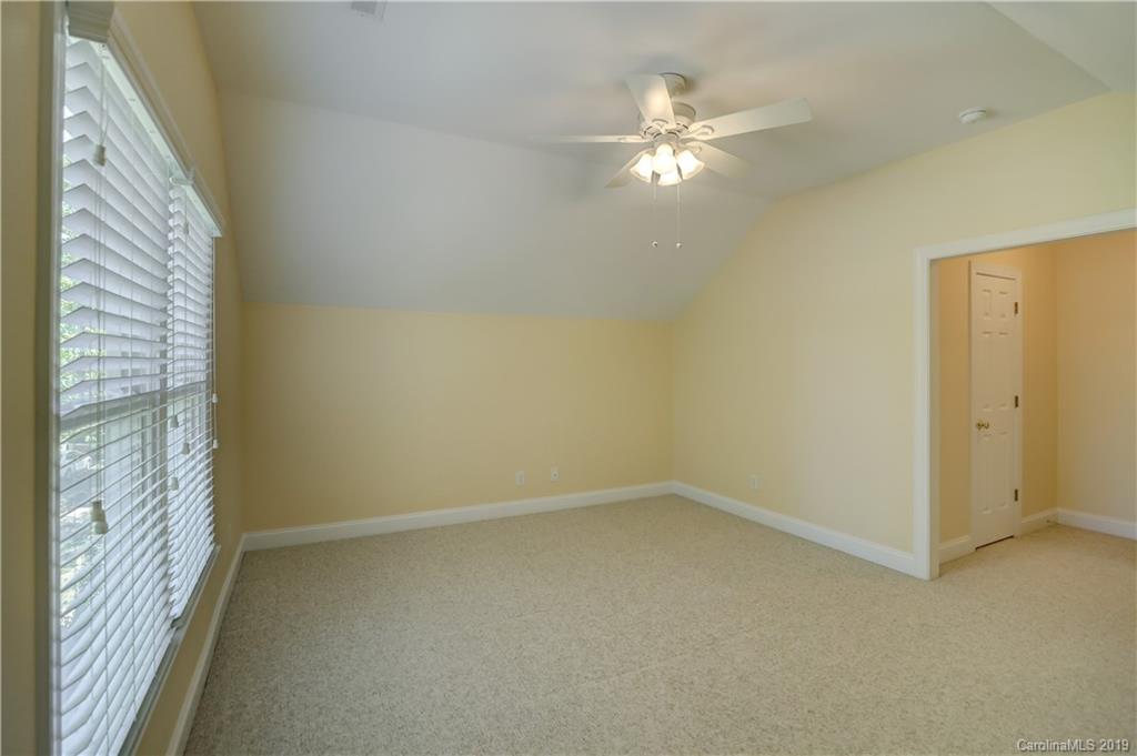 779 Julia Street Fort Mill, SC 29708 - Photo 32 of 48 a view of a chandelier fan in a room