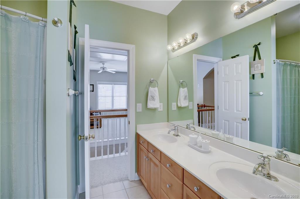 779 Julia Street Fort Mill, SC 29708 - Photo 36 of 48 a bathroom with a sink double vanity and a shower