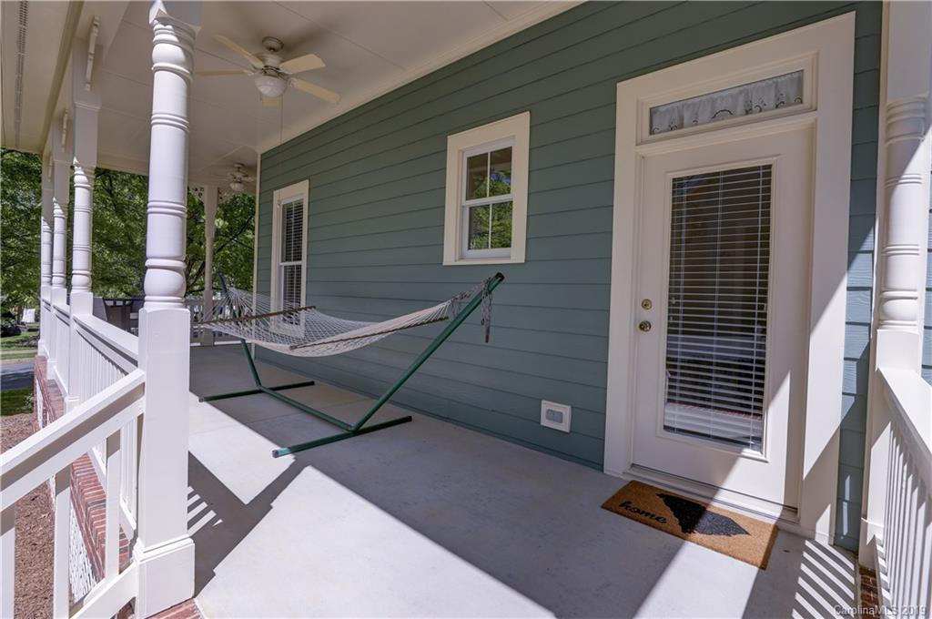 779 Julia Street Fort Mill, SC 29708 - Photo 43 of 48 a roof deck with table and chairs and wooden floor
