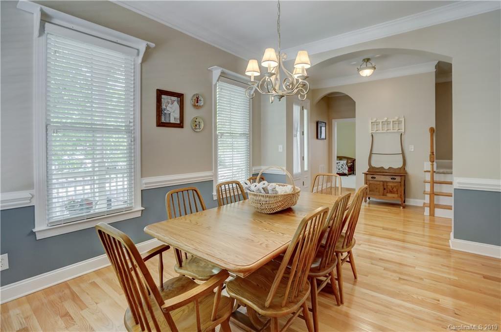 779 Julia Street Fort Mill, SC 29708 - Photo 7 of 48 a view of a dining room with furniture a chandelier and wooden floor