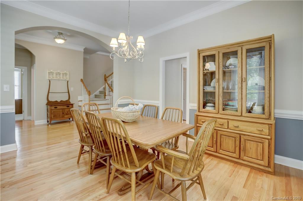 779 Julia Street Fort Mill, SC 29708 - Photo 8 of 48 a view of a dining room with furniture and wooden floor